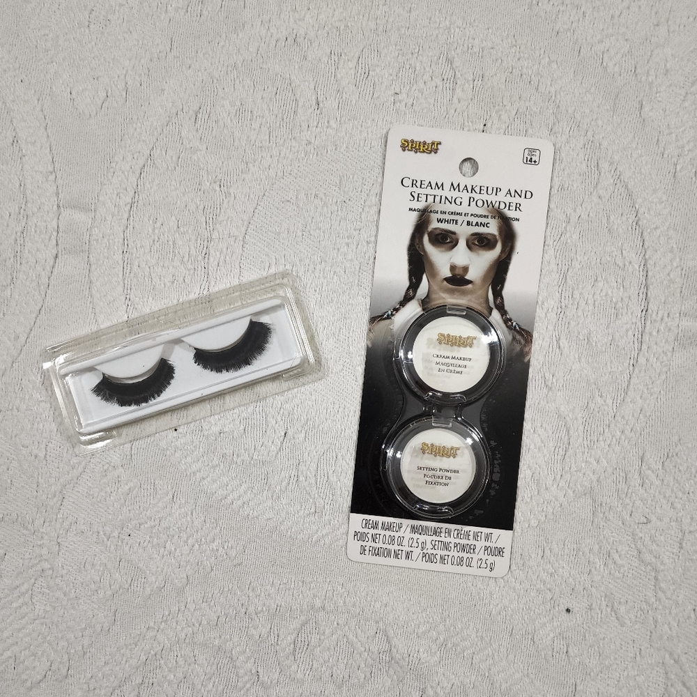 Fake lashes & white face makeup